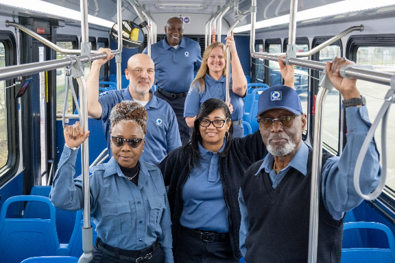 Employees riding Metro bus