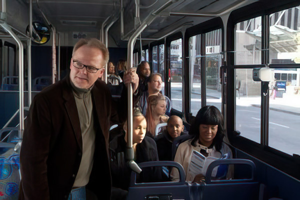 man standing inside bus