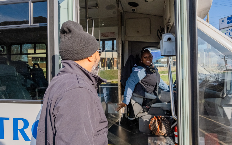 man getting on bus