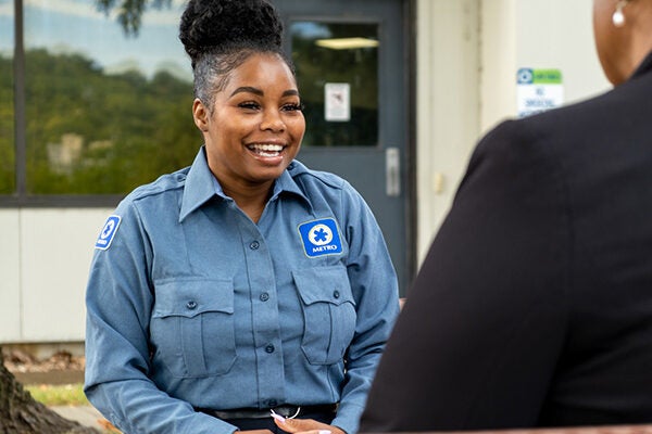 Metro employee helping customer